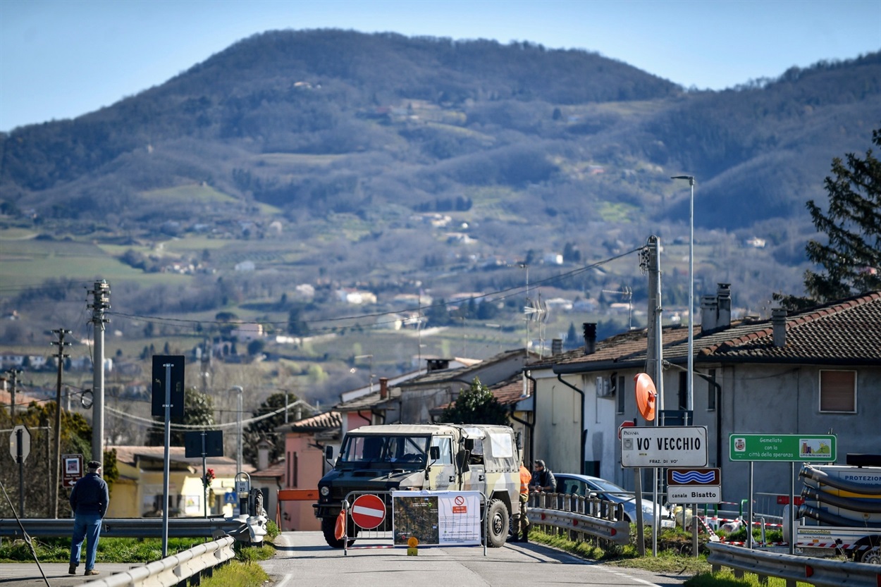 Italian military guarding a roadblock leading to the village of Vo’Euganeo