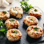 Фаршировані печериці з куркою і сиром