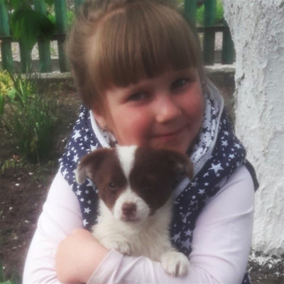 Мілана Фесик зі своїм цуценятком Красунею