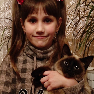 Владислава Лябах із сіамцем Томом 